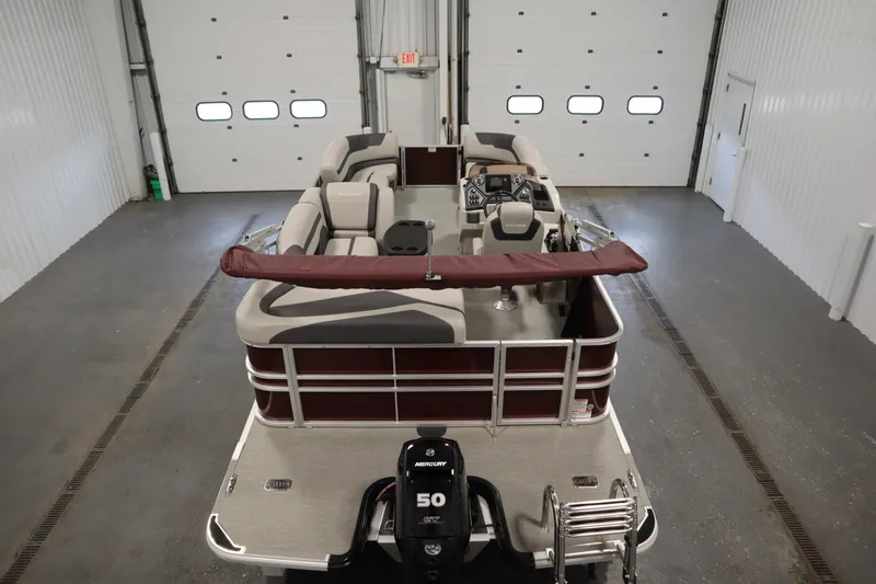 Slide: The Image of 2022 Sylvan 21 L-1 CRS pontoon boat in indoor storage facility. - 3