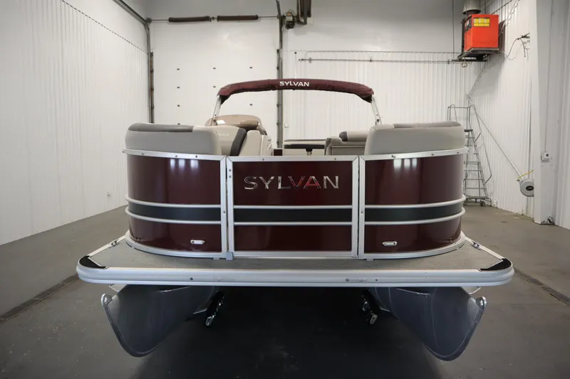Slide: The Image of 2022 Sylvan 21 L-1 CRS pontoon boat in a garage, rear view. - 36