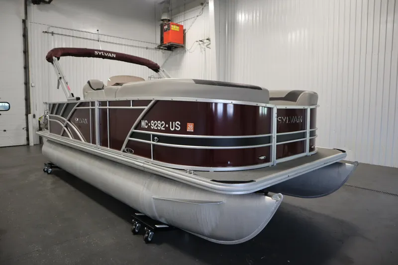 Slide: The Image of 2022 Sylvan 21 L-1 CRS pontoon boat in indoor storage facility. - 37
