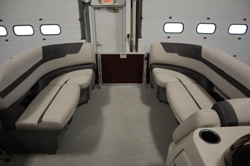 Slide: The Image of 2022 Sylvan 21 L-1 CRS boat interior with plush seating and modern design. - 4
