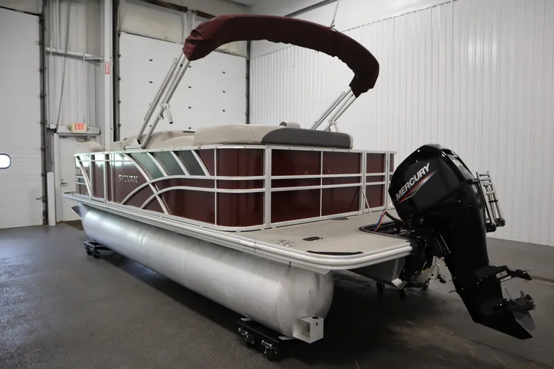 Slide: The Image of 2022 Sylvan 21 L-1 CRS pontoon boat with Mercury outboard motor in a garage. - 41