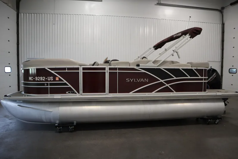 Slide: The Image of 2022 Sylvan 21 L-1 CRS pontoon boat in indoor storage, side view. - 42