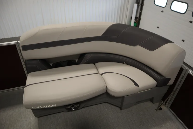 Slide: The Image of 2022 Sylvan 21 L-1 CRS boat interior with beige and black seating. - 5