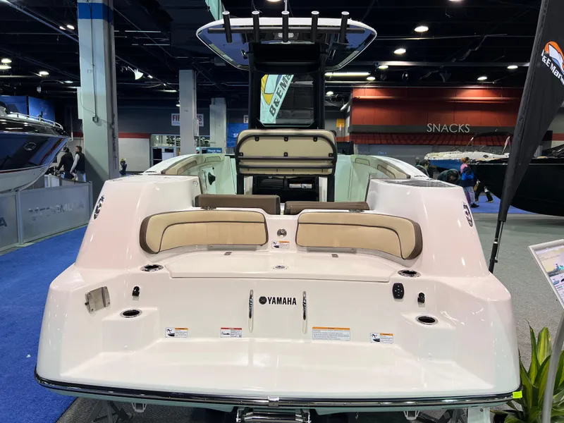 Slide: The Image of 2025 Yamaha Boats 255 FSH Sport H displayed at a boat show, rear view. - 3