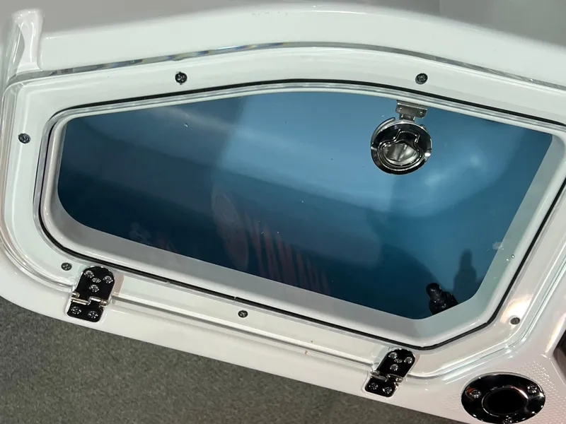 Slide: The Image of 2025 Yamaha Boats 255 FSH Sport H storage compartment with secure latch and sleek design. - 6