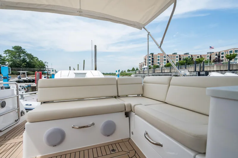 Slide: The Image of Luxurious seating area on 2025 MJM 3 yacht, docked with scenic waterfront view. - 19