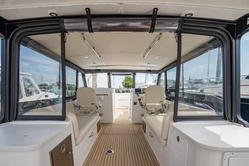 Slide: The Image of Interior view of 2025 MJM 3 boat, featuring sleek seating and modern design. - 21