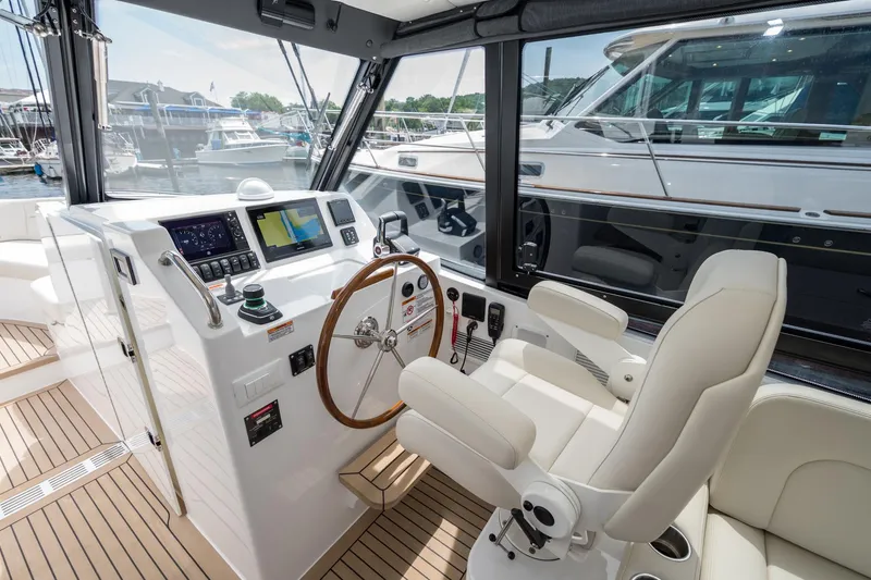 Slide: The Image of Luxurious 2025 MJM 3 yacht cockpit with modern navigation system and plush seating. - 22