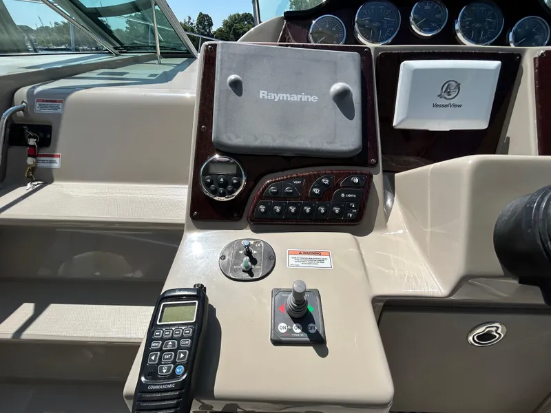 Slide: The Image of Control panel of a 2008 Sea Ray 330 Sundancer boat with navigation equipment. - 13
