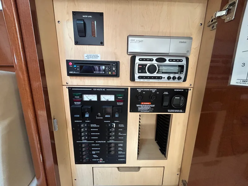 Slide: The Image of Control panel of a 2008 Sea Ray 330 Sundancer boat with various switches and meters. - 19