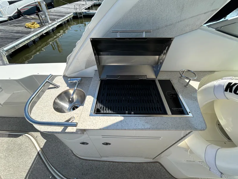 Slide: The Image of Outdoor kitchen on 2008 Sea Ray 330 Sundancer yacht with grill and sink. - 8