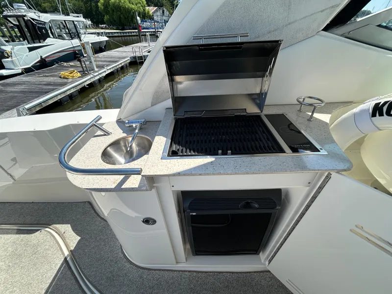 Slide: The Image of Outdoor kitchenette on 2008 Sea Ray 330 Sundancer yacht with grill and sink. - 9