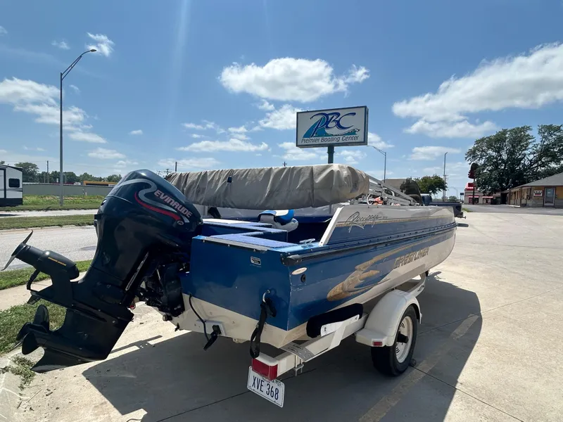 Slide: The Image of 1999 Crestliner Rampage 2000 boat with Evinrude motor at Premier Boating Center. - 8