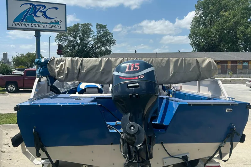 Slide: The Image of 1999 Crestliner Rampage 2000 boat with outboard motor at Premier Boating Center. - 9