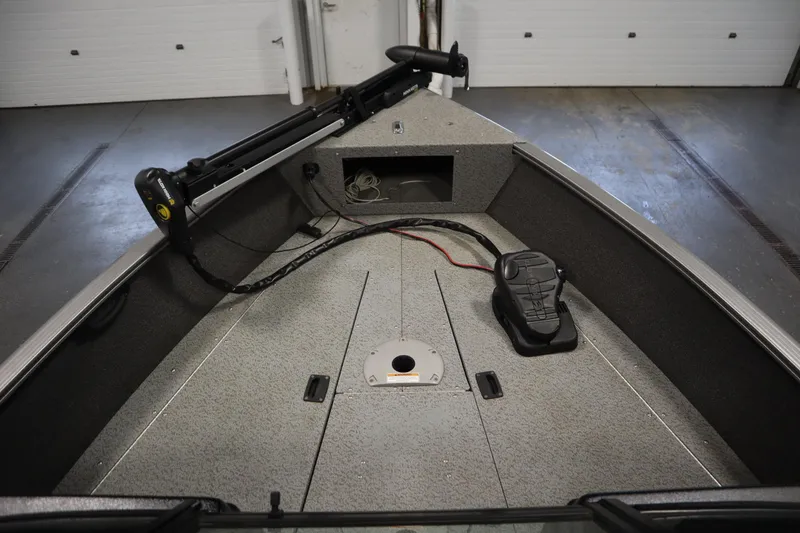 Slide: The Image of 2021 Lund 1675 ADVENTURE WT boat interior with trolling motor and foot pedal. - 11