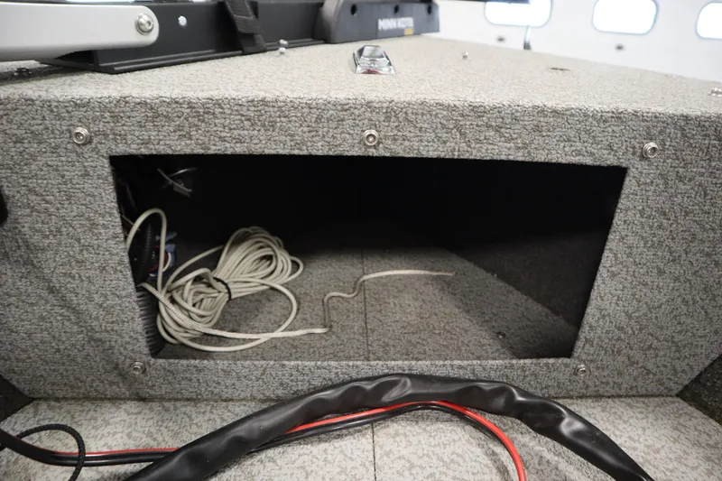 Slide: The Image of Interior view of 2021 Lund 1675 ADVENTURE WT boat storage compartment with cables. - 16