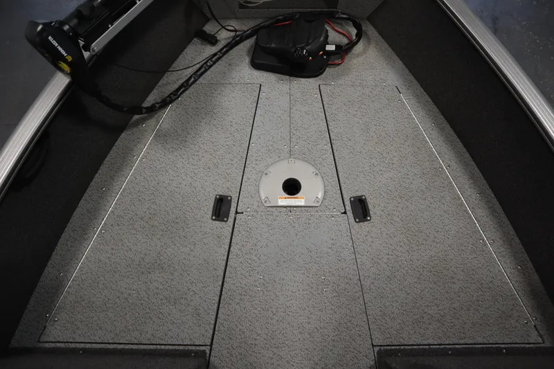 Slide: The Image of 2021 Lund 1675 ADVENTURE WT boat interior with storage compartments and trolling motor. - 17