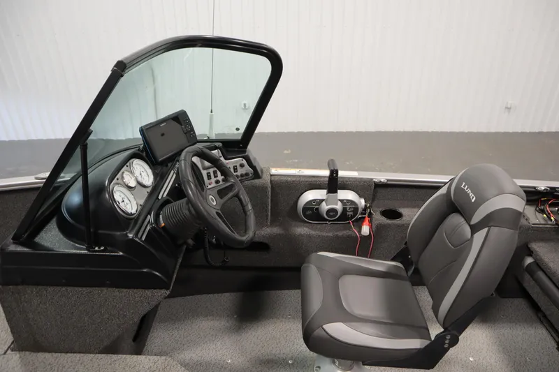 Slide: The Image of 2021 Lund 1675 ADVENTURE WT boat interior with steering wheel and seat. - 21