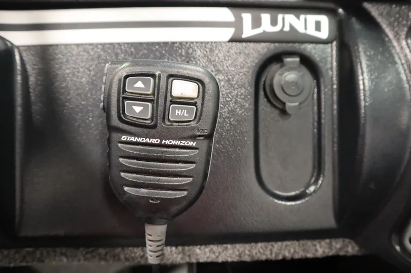 Slide: The Image of Standard Horizon radio microphone on 2021 Lund 1675 Adventure WT boat dashboard. - 26