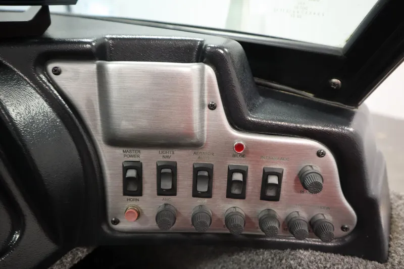 Slide: The Image of Control panel of 2021 Lund 1675 ADVENTURE WT boat with switches and knobs. - 28
