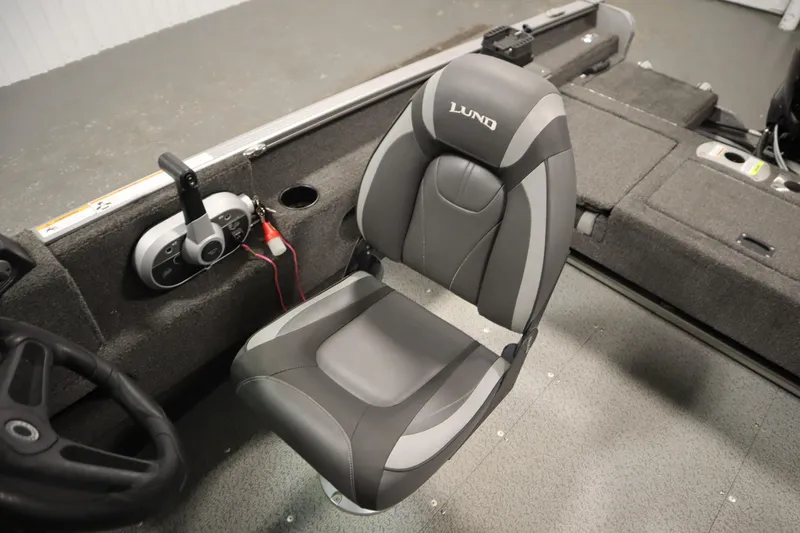 Slide: The Image of 2021 Lund 1675 ADVENTURE WT boat interior with steering wheel and seat. - 30