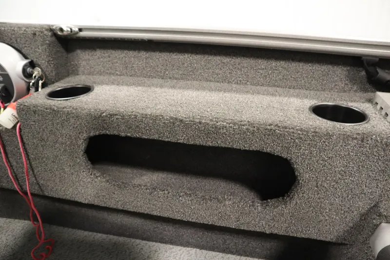 Slide: The Image of 2021 Lund 1675 ADVENTURE WT boat interior with cup holders and storage compartment. - 40