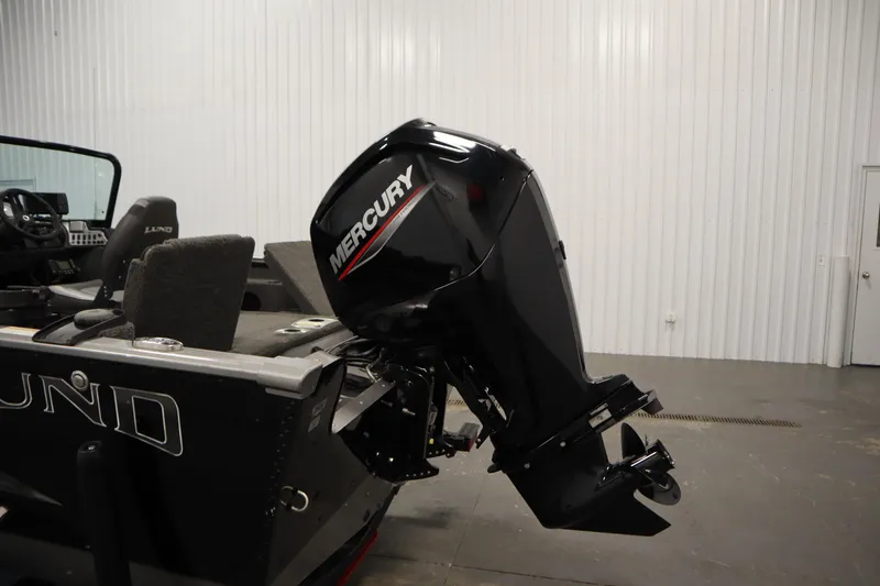 Slide: The Image of 2021 Lund 1675 ADVENTURE WT boat with Mercury outboard motor in a garage setting. - 47