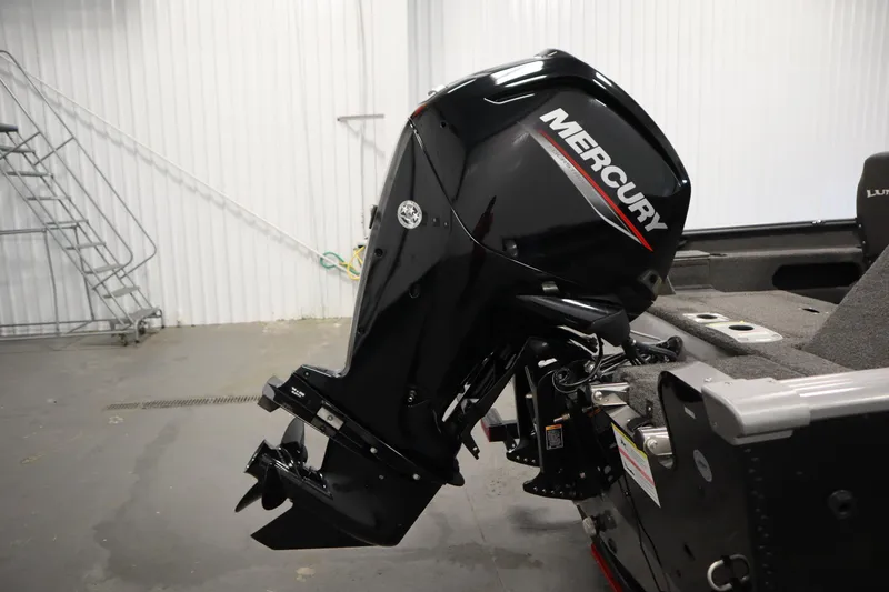 Slide: The Image of 2021 Lund 1675 ADVENTURE WT boat with Mercury outboard motor in a garage setting. - 48