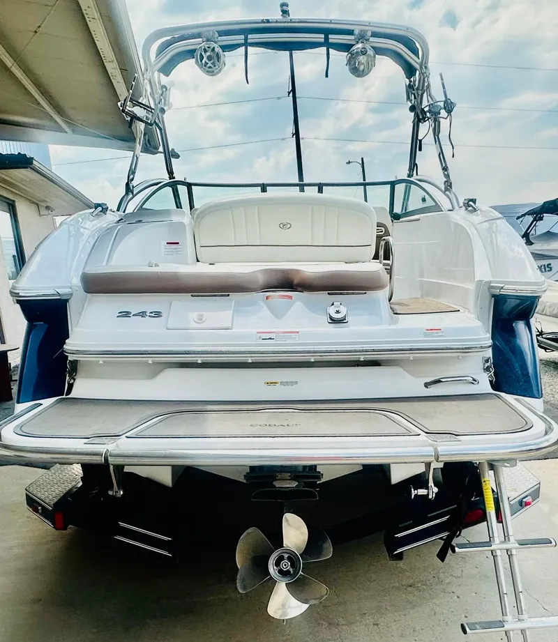 Slide: The Image of 2012 Cobalt 243 boat rear view with swim platform and propeller. - 4