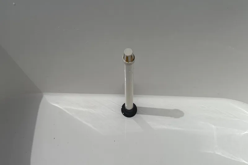 Slide: The Image of Close-up of Ocean Master 296 boat component, 2015 model, featuring a white and metallic fixture. - 12