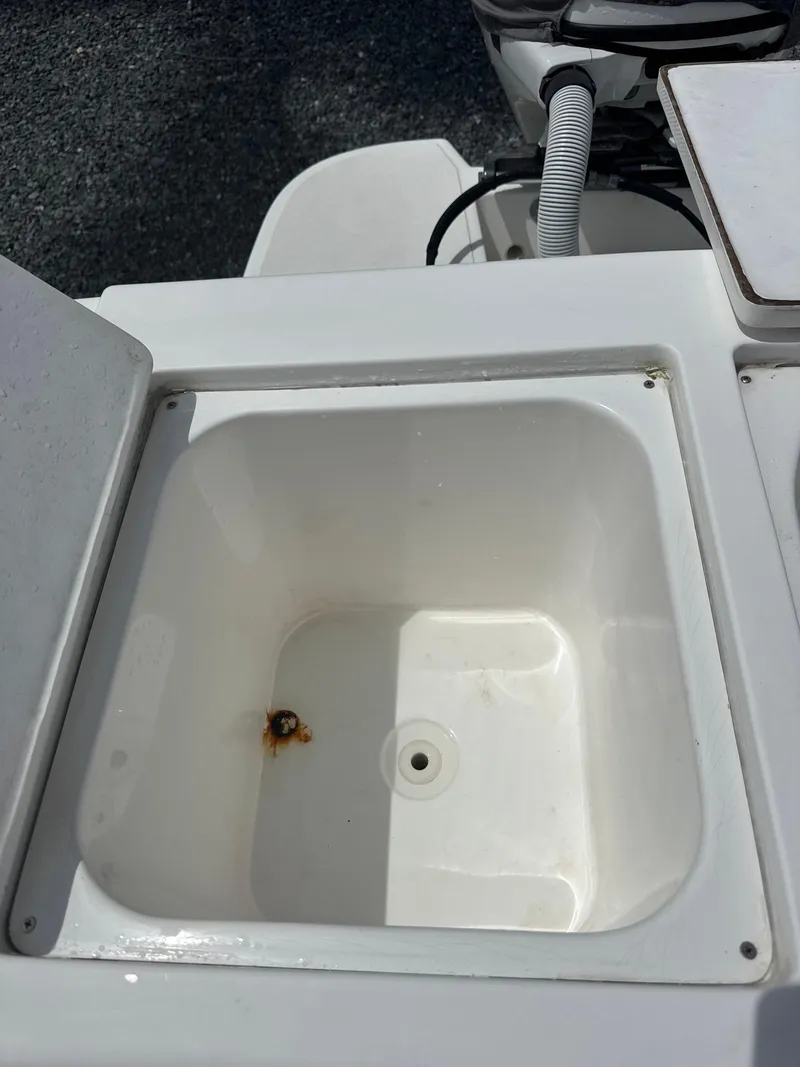 Slide: The Image of Open storage compartment on 2015 Ocean Master 296 boat, showing interior detail. - 5