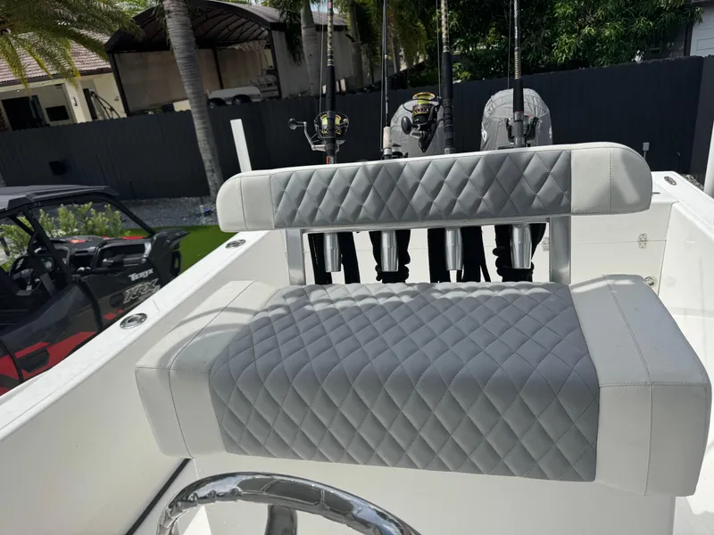 Slide: The Image of Luxury seating on a 2015 Ocean Master 296 boat with fishing rods in holders. - 6