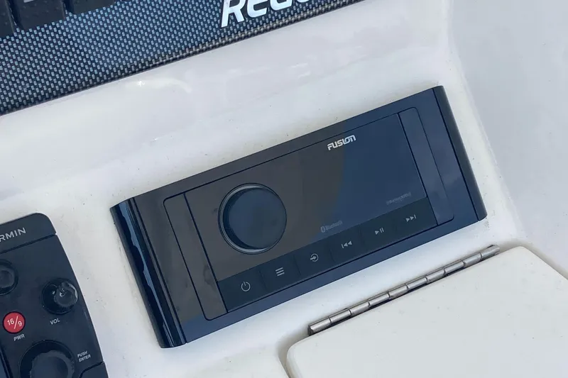 Slide: The Image of Fusion audio system on 2015 Regulator 25FS Center Console boat dashboard. - 25