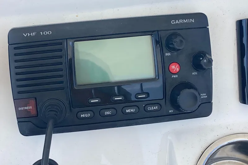 Slide: The Image of Garmin VHF 100 radio on 2015 Regulator 25FS Center Console boat. - 27