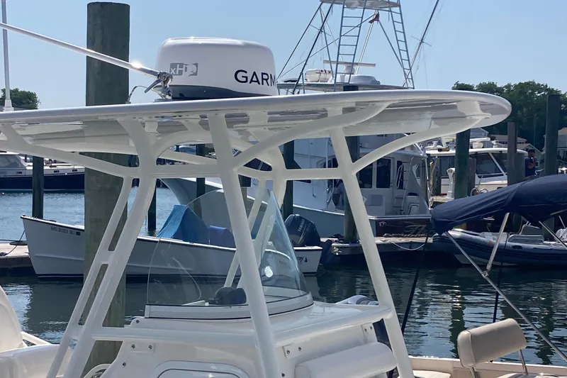 Slide: The Image of 2015 Regulator 25FS Center Console boat with Garmin radar at marina. - 28