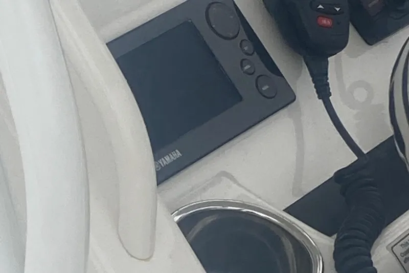 Slide: The Image of Control panel of 2015 Regulator 25FS Center Console with Yamaha display and radio. - 35