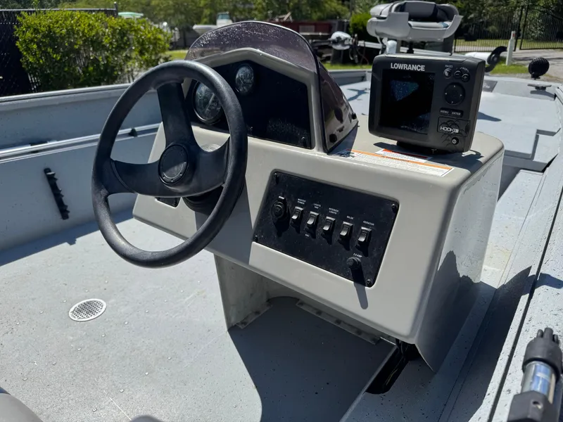 Slide: The Image of 2017 G3 20SC DLX boat console with steering wheel and Lowrance fish finder. - 11