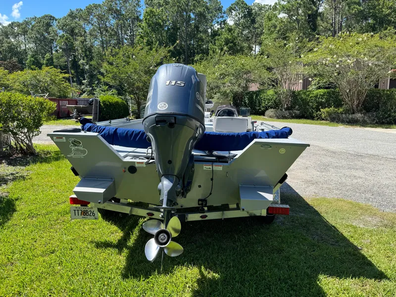 Slide: The Image of 2017 G3 20SC DLX boat with 115 HP motor, parked on grass. - 3