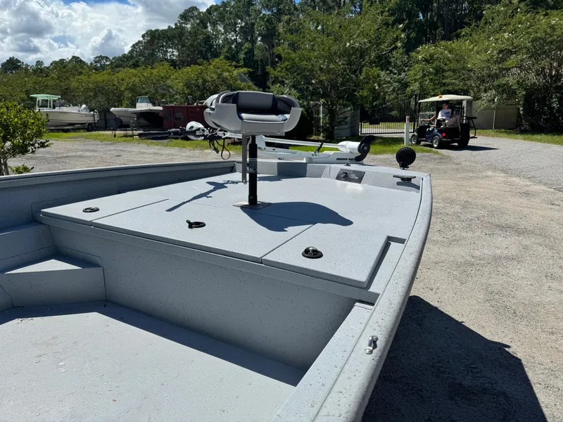 Slide: The Image of 2017 G3 20SC DLX boat on a sunny day, parked outdoors with trees in the background. - 6