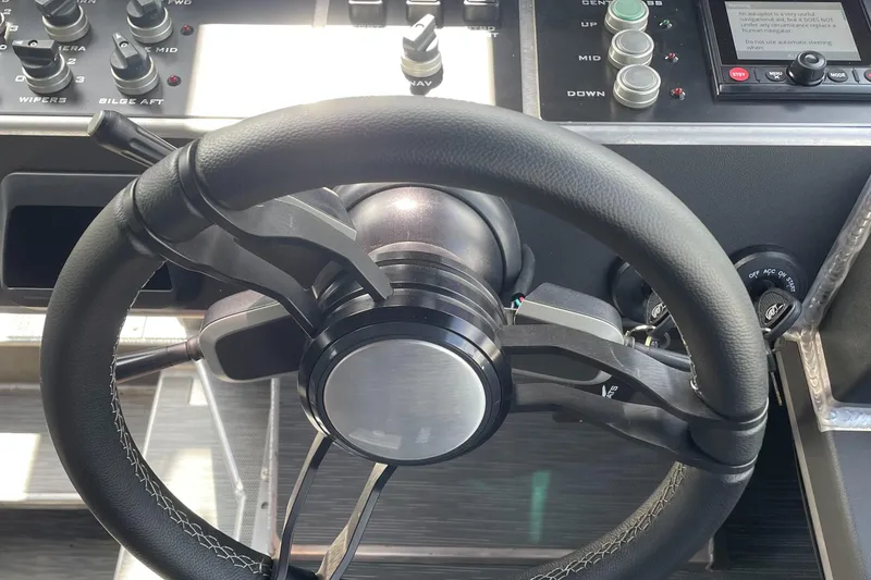 Slide: The Image of Steering wheel and controls of 2024 Viggo C10 boat cockpit. - 10