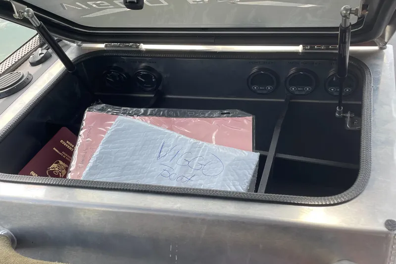 Slide: The Image of Open storage compartment in 2024 Viggo C10 with documents and controls. - 15