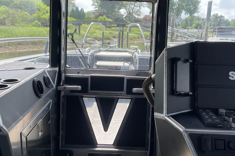 Slide: The Image of Interior view of 2024 Viggo C10 boat cockpit with control panel and windows. - 17