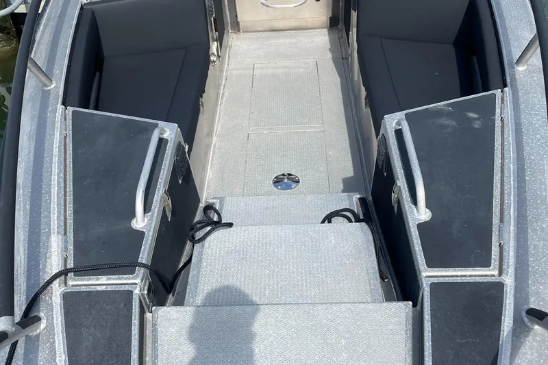 Slide: The Image of Interior view of 2024 Viggo C10 boat, featuring seating and storage compartments. - 19