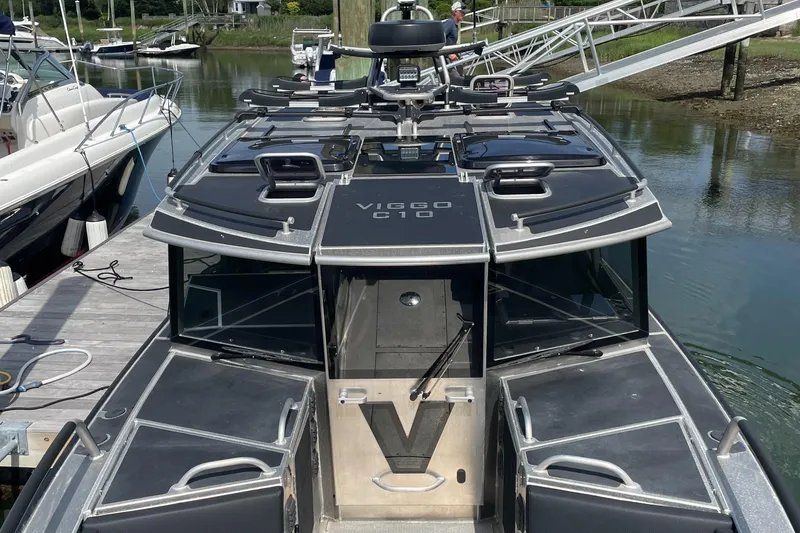 Slide: The Image of 2024 Viggo C10 boat docked, showcasing sleek design and modern features. - 5