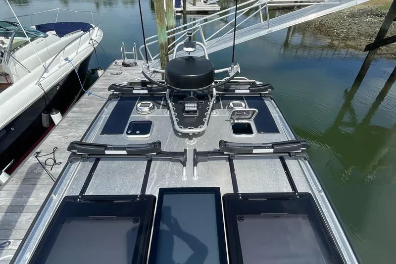 Slide: The Image of 2024 Viggo C10 boat deck with advanced equipment, docked beside another vessel. - 6