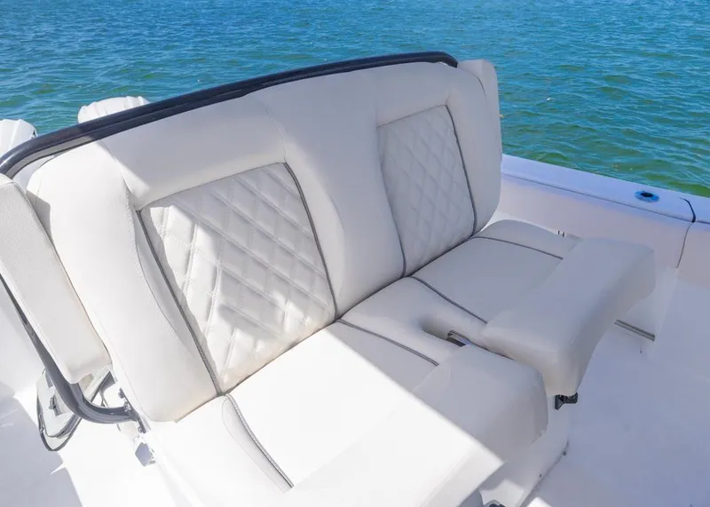 Slide: The Image of Luxurious seating on 2026 Sea Hunt Gamefish 27 boat, featuring elegant white upholstery. - 13