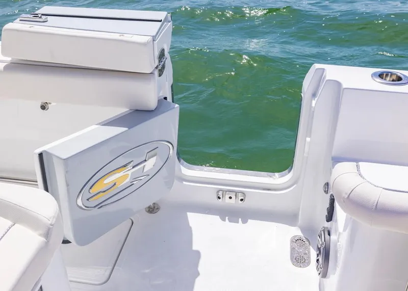 Slide: The Image of 2026 Sea Hunt Gamefish 27 boat with open side door, ocean view. - 18