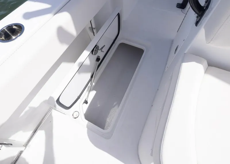 Slide: The Image of Open storage compartment on 2026 Sea Hunt Gamefish 27 Forward Seating boat. - 21
