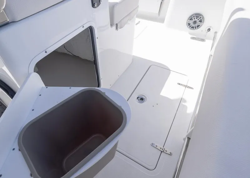 Slide: The Image of 2026 Sea Hunt Gamefish 27 Forward Seating interior with storage and speaker. - 22