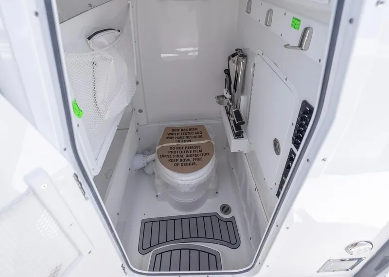 Slide: The Image of Interior of 2026 Sea Hunt Gamefish 27 boat with compact restroom facilities. - 23